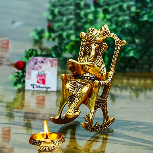 Golden Lord Ganesha Statue Sitting On A Rocking Chair