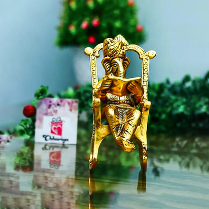 Golden Lord Ganesha Statue Sitting On A Rocking Chair