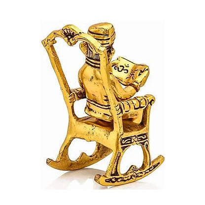 Golden Lord Ganesha Statue Sitting On A Rocking Chair